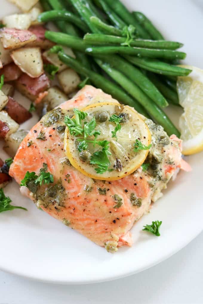 Dijon Lemon Caper Salmon Served With Roasted Dill Red Potatoes And