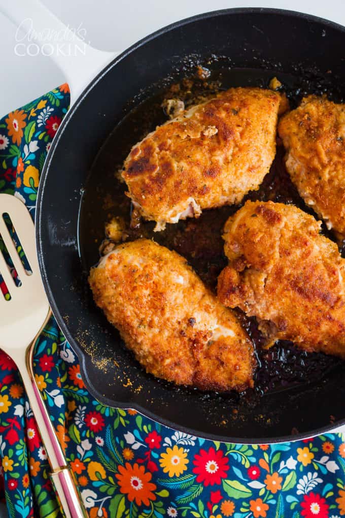 Oven fried chicken in a skillet