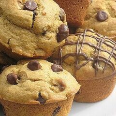 A close up photo of chocolate chip pumpkin muffins.