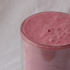 A close up photo of a cherry fruit smoothie.