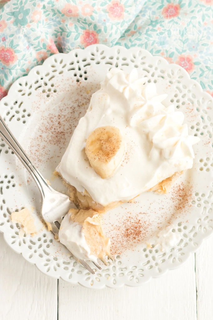 slice of banana cream pie with a fork on the plate