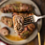 forking holding a slice of Grilled Cube Steak Rollups