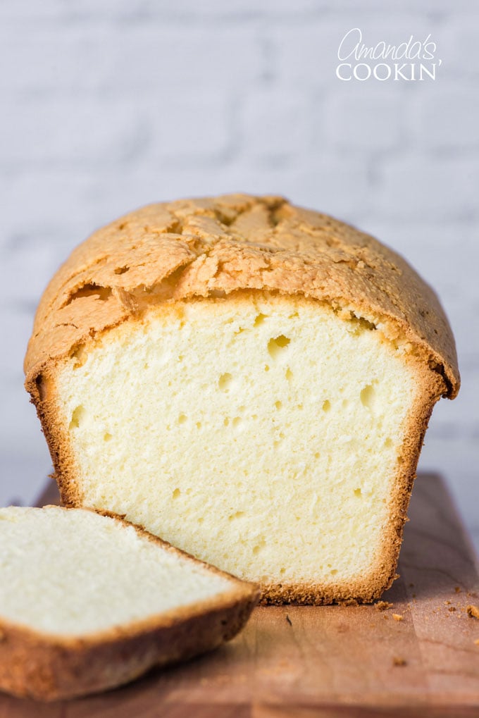 whipping cream pound cake with a slice out of it