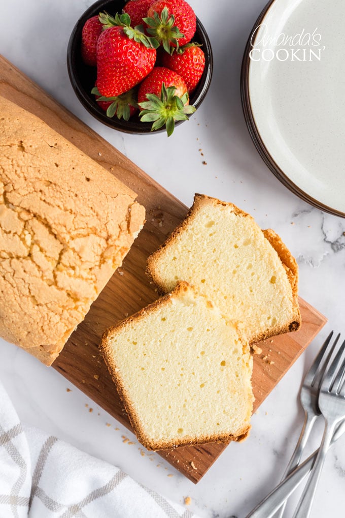 overhead view of sliced pound cake on cutting board