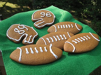 A photo of soft gingerbread football cookies resting on a napkin.