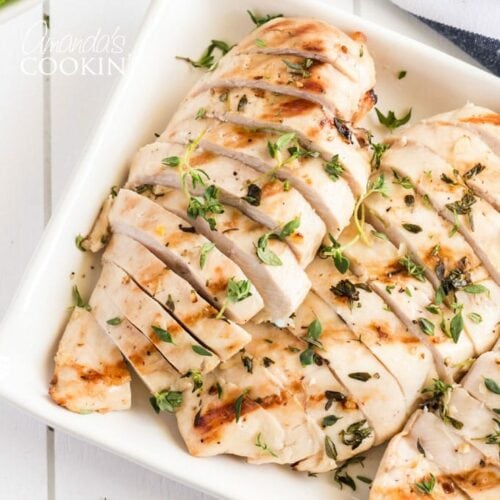 sliced grilled chicken breasts on a platter