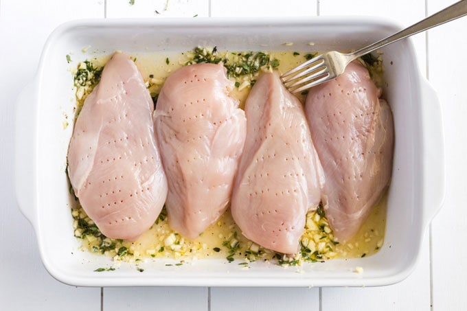 chicken breasts that have been pierced with a fork
