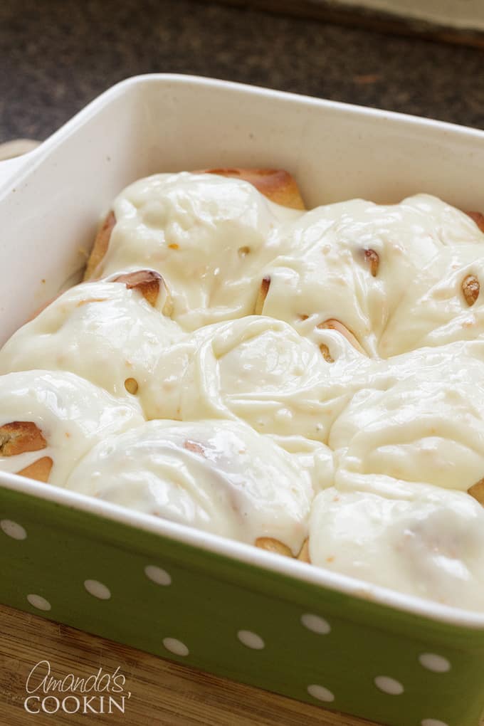 frosted orange rolls in pan