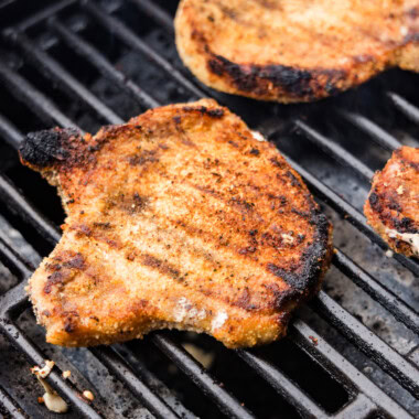 close up of pork chop on grill