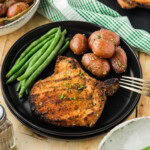 Grilled Breaded Pork Chop on plate with sides
