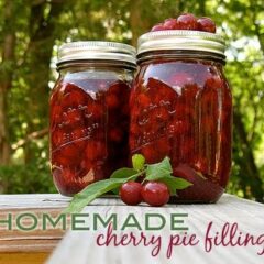 A photo of two jars of homemade cherry pie filling.