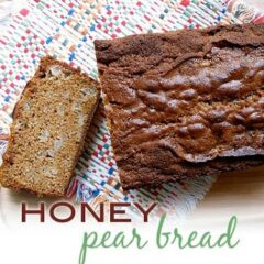 An overhead photo of a loaf of honey pear bread with a slice on the side.