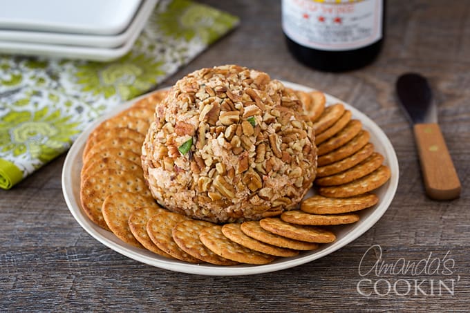 cheese ball with crackers on a plate