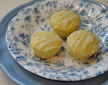 A close up photo of three German mini lemon cakes in a blue and white dish.