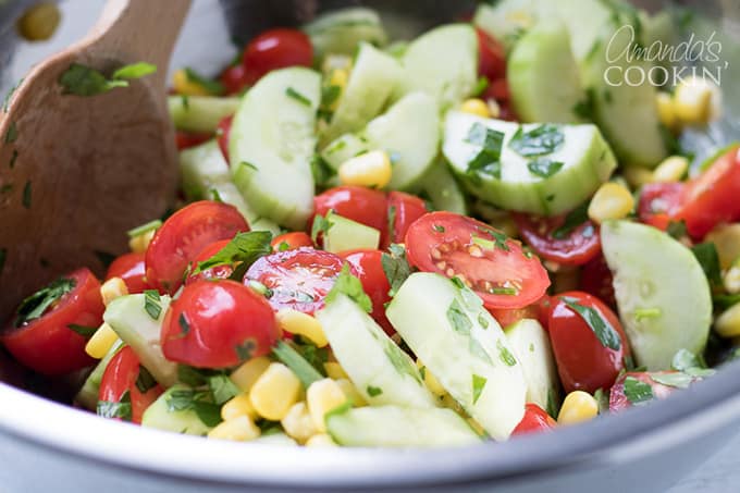 Toss to combine to summer vegetable quinoa salad.