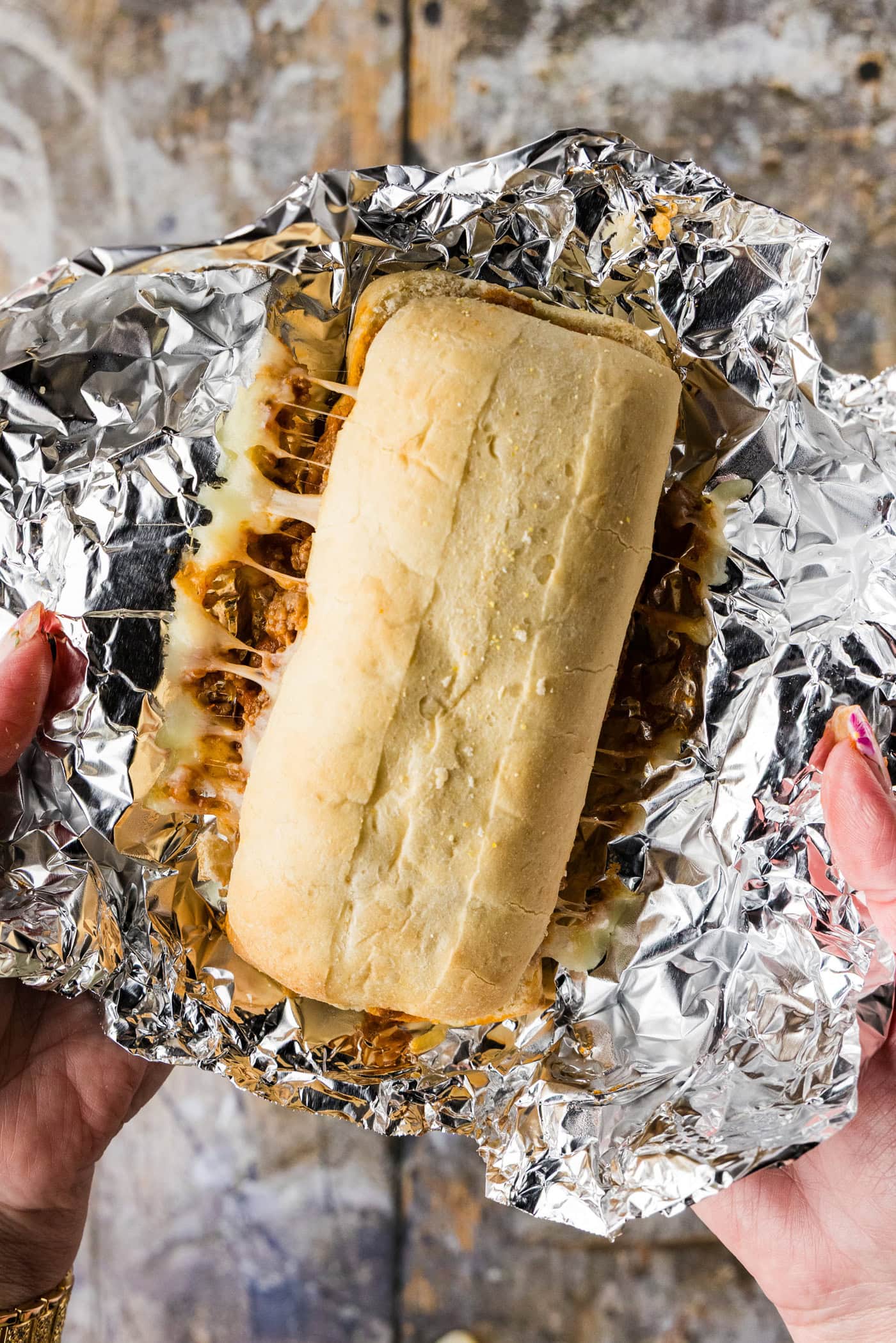 guinea grinder sandwich unwrapped from foil after baking