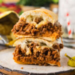 halved Guinea Grinder sandwich stacked on plate