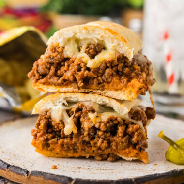 halved Guinea Grinder sandwich stacked on plate