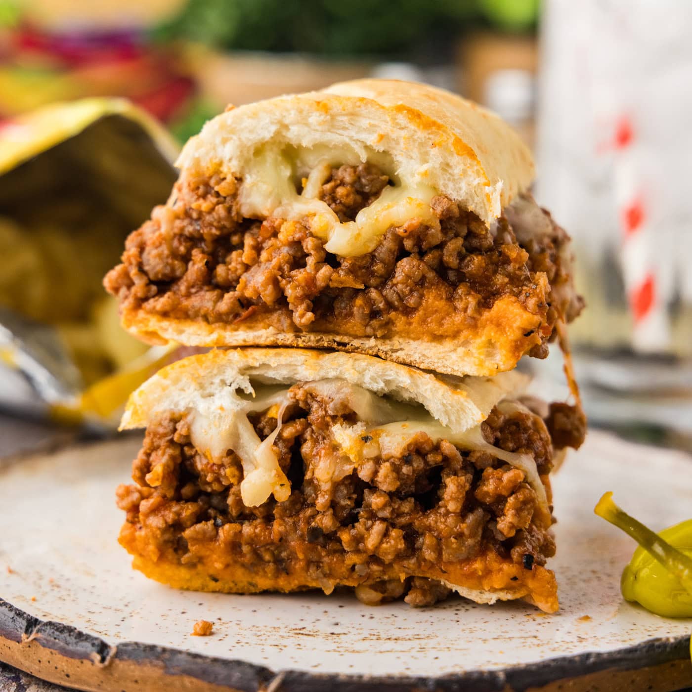 halved Guinea Grinder sandwich stacked on plate