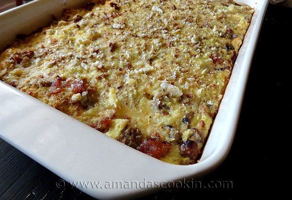 A close up photo of a herbed breakfast stuffing casserole.