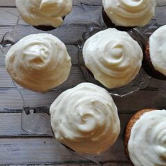 An overhead photo of banana cupcakes with vanilla cream cheese frosting.