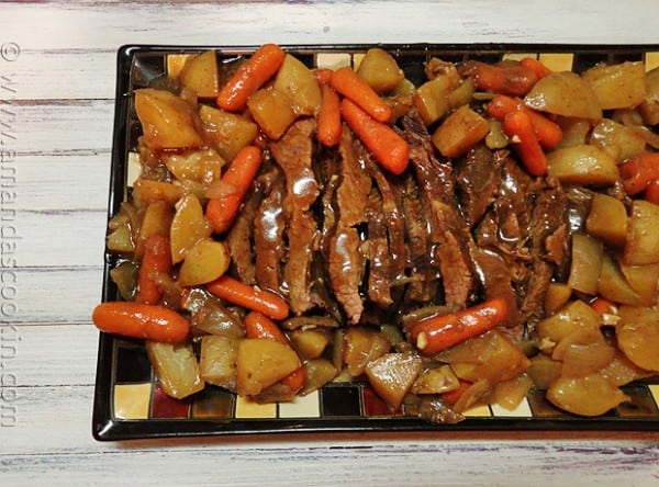 An overhead photo of a plate of slow cooker java brisket.