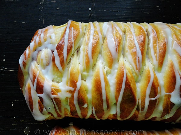 A close up overhead photo of a braided blackberry breakfast Danish.