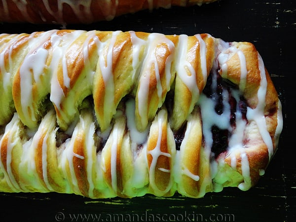 A close up overhead photo of a braided blackberry breakfast Danish.