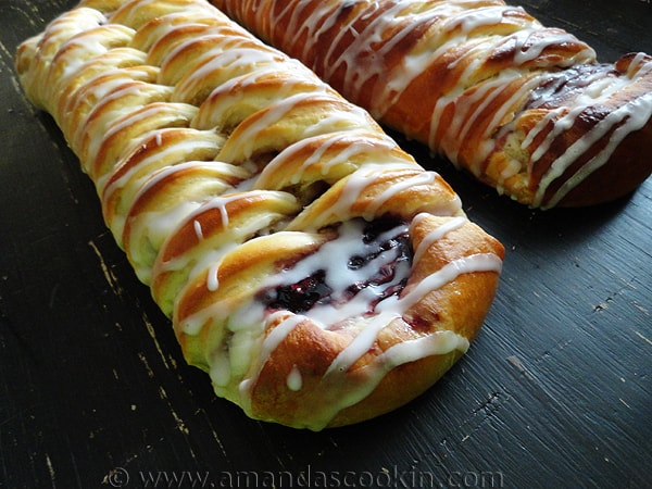 A close up photo of braided blackberry breakfast Danishes. 