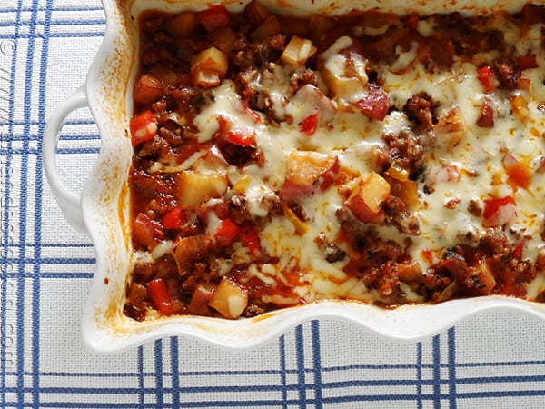 An overhead photo of a sweet Italian sausage, pepper and potato bake.