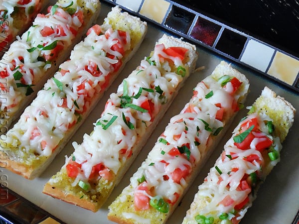 An overhead photo of mozzarella provolone bruschetta. 