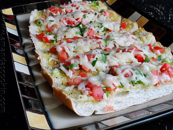 An overhead photo of mozzarella provolone bruschetta. 