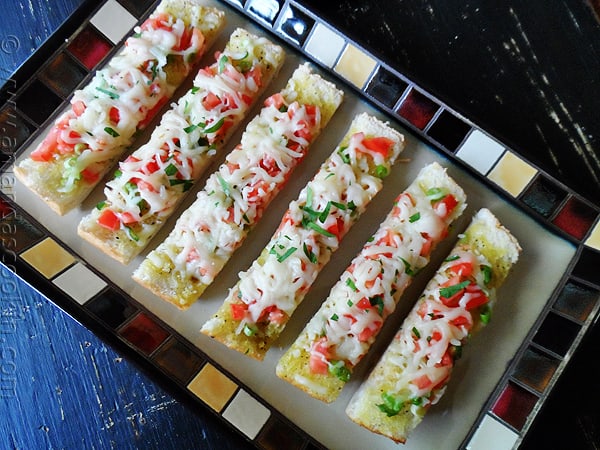 An overhead photo of mozzarella provolone bruschetta. 