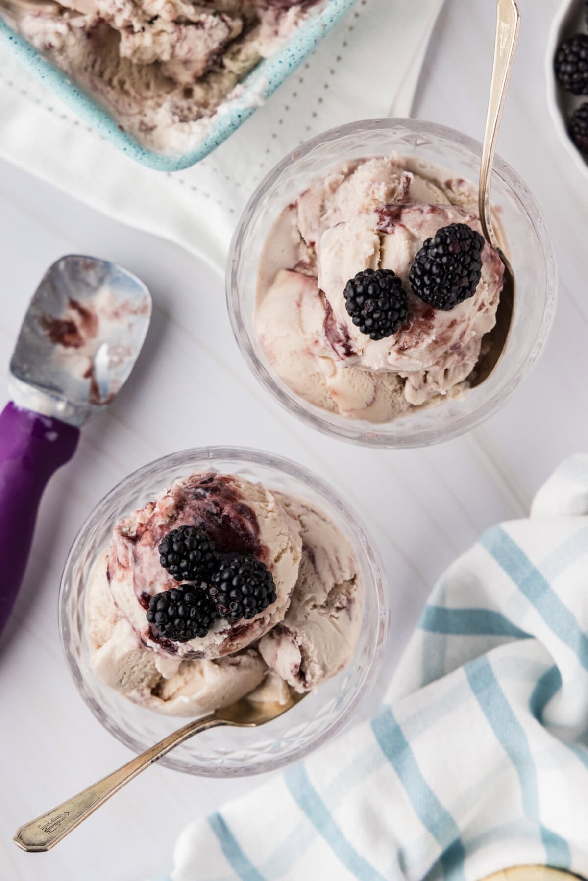 over head photo of two dishes of jam ice cream with blackberries