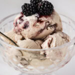 jam ice cream in dish with blackberries on top