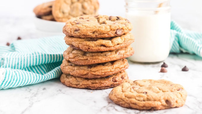 stack of cookies with glass of milk