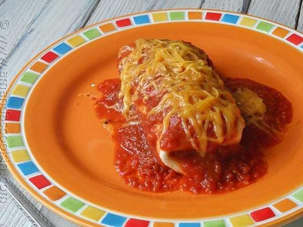 A close up photo of a Taco Bell enchirito copycat resting on a plate.