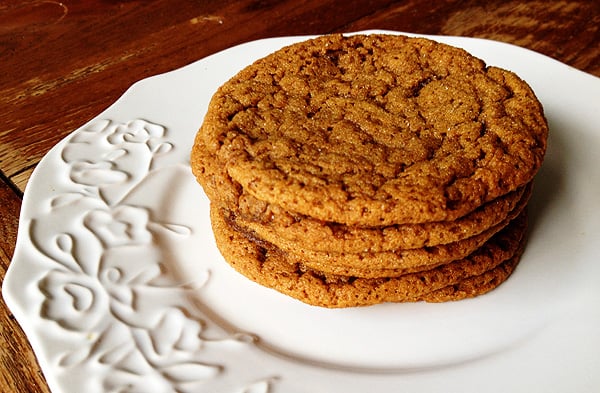 A close up photo of a stack of sugar topped molasses spice cookies