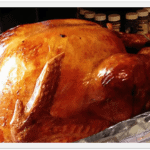 A close up photo of a cooked turkey.