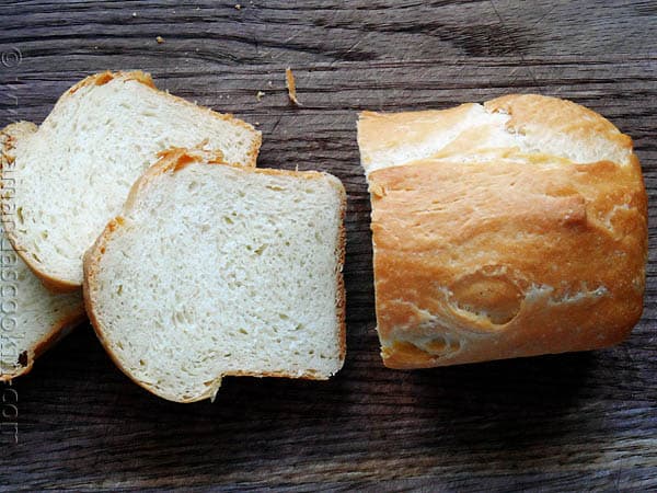 An overhead photo of a sliced Amish white bread mini loaf.