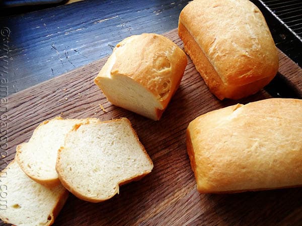 A photo of a sliced Amish white bread mini loaves. 