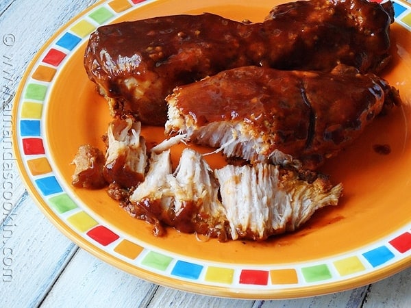 A close up photo of slow cooker barbecued country style ribs on a plate.