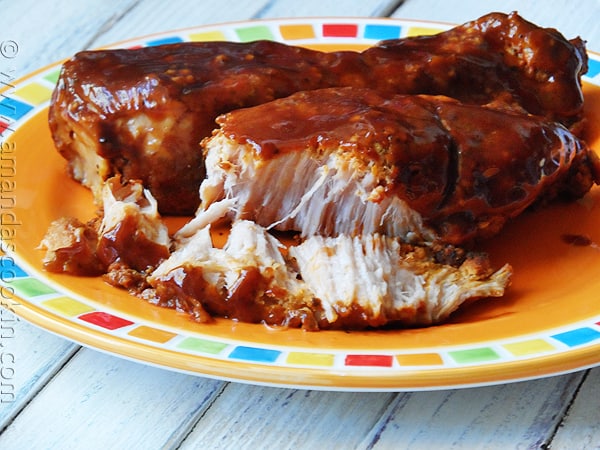 A close up photo of slow cooker barbecued country style ribs on a plate.
