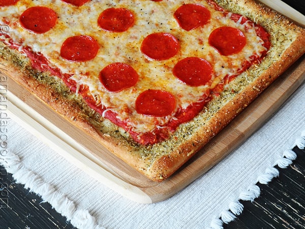 A close up photo of garlic bread crusted classic pizza.