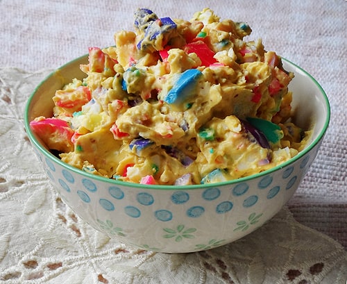 A photo of rainbow egg salad in a bowl.