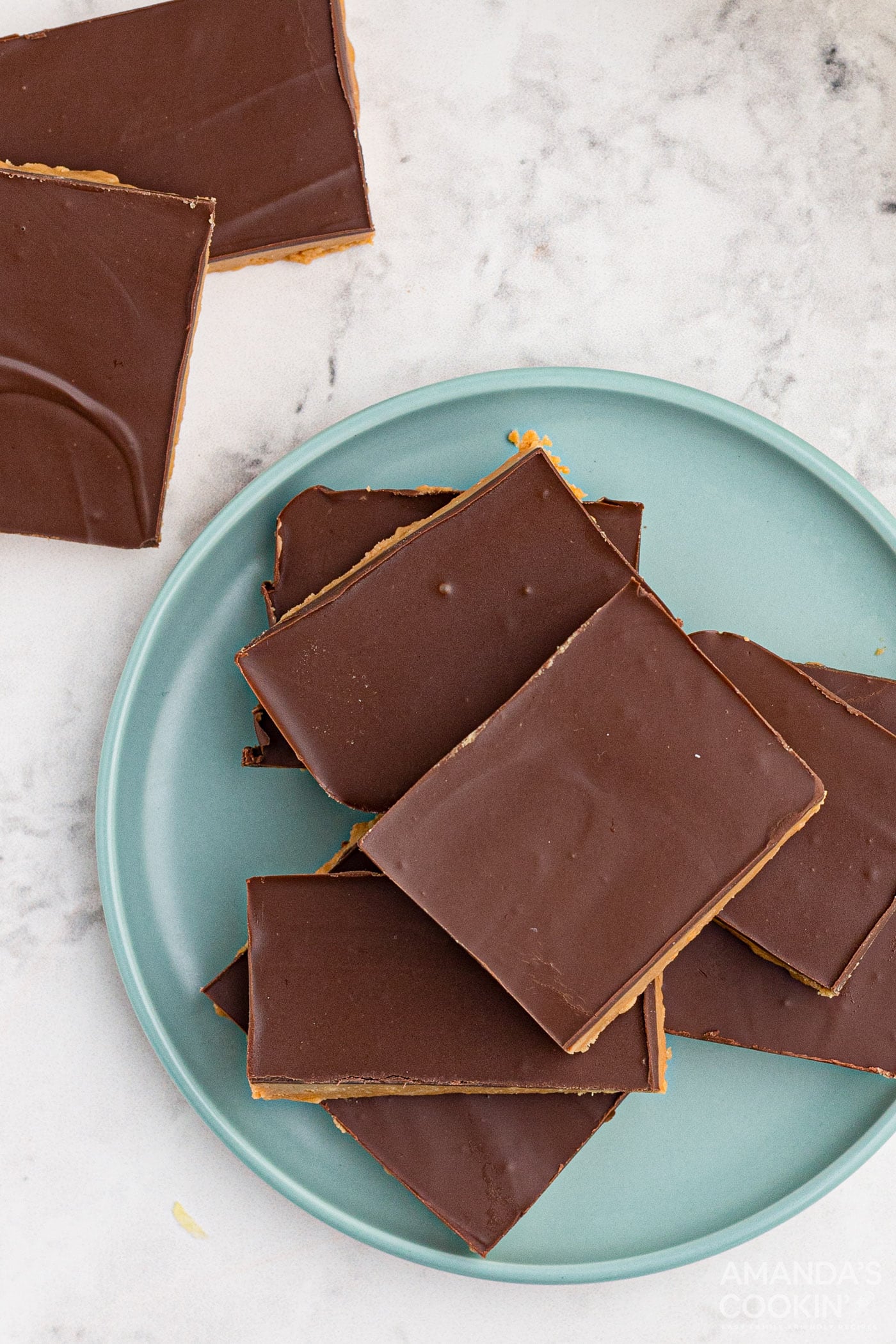 chocolate frosted peanut butter bars on a plate