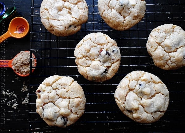 An overhead photo of cherry white chocolate chip cookies on a cooling rack.