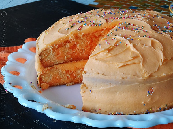 Orange Poke Cake from AmandasCookin.com @amandaformaro