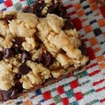 A close up overhead photo of a peanut butter chocolate layer bar.