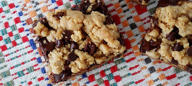 A close up overhead photo of a peanut butter chocolate layer bar.